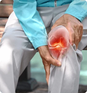 A man holding his knee in knee pain.