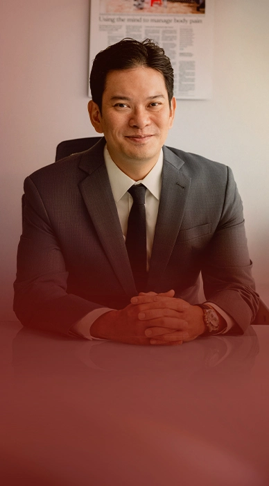 Doctor Thor Timothy, seated at Novena Pain Management Centre