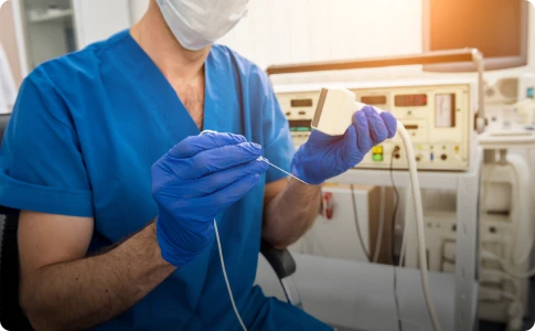 Doctor holding a radiofrequency treatment device